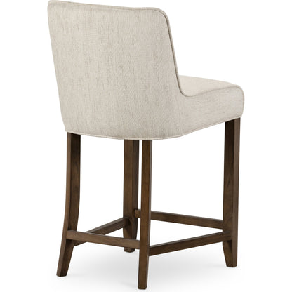 Aria Counter Stool by Four Hands in sienna chestnut. Made from top grain leather, solid nettlewood, 100% polyester in a modern style.