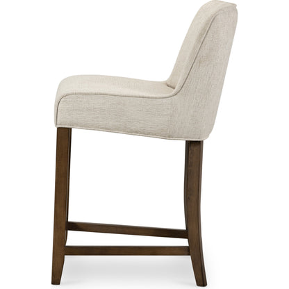 Aria Counter Stool by Four Hands in sienna chestnut. Made from top grain leather, solid nettlewood, 100% polyester in a modern style.