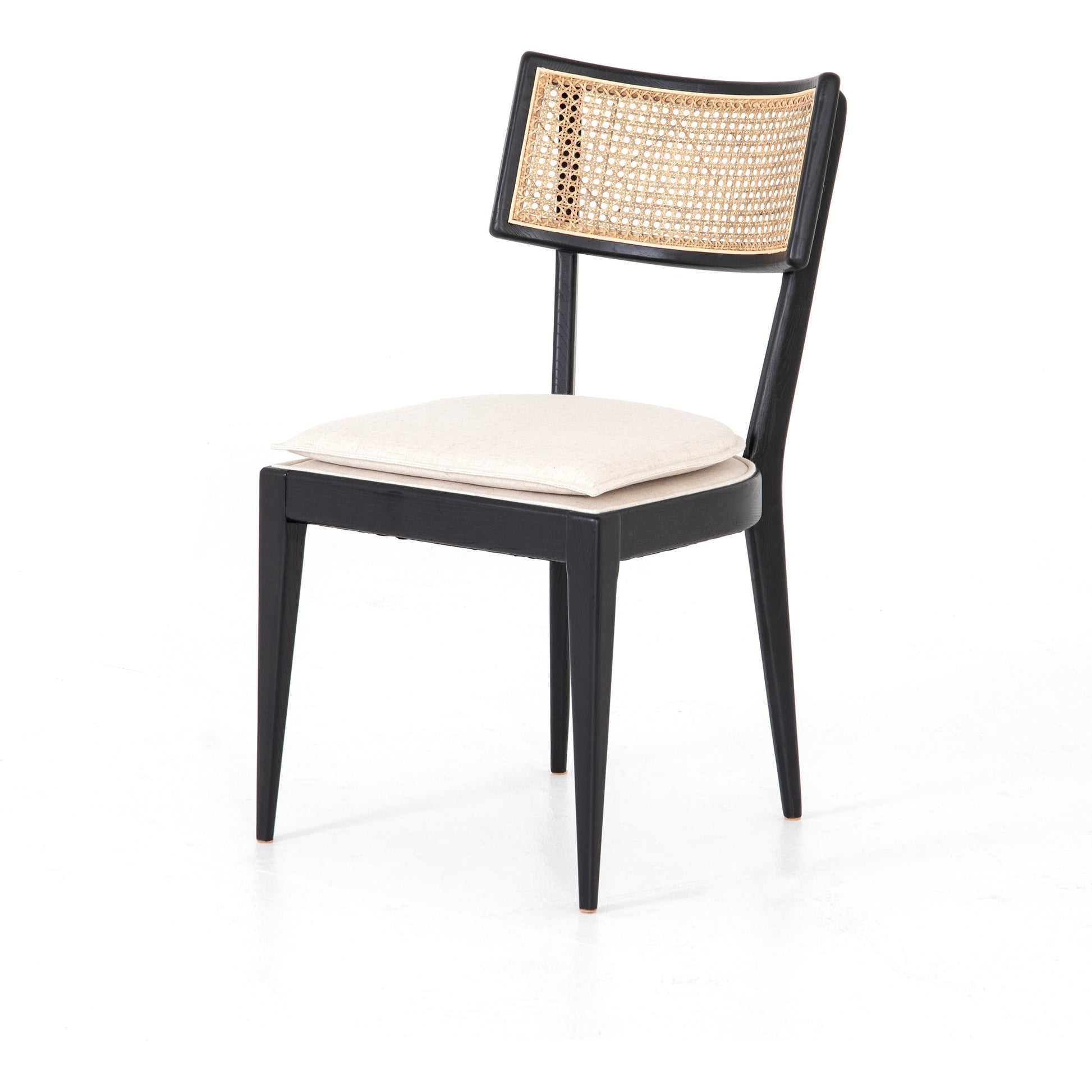 Britt Dining Chair by Four Hands in natural cane, savile flax, brushed ebony. Made from 92% polyester, 8% flax, linen, solid nettlewood, cane in a modern style.