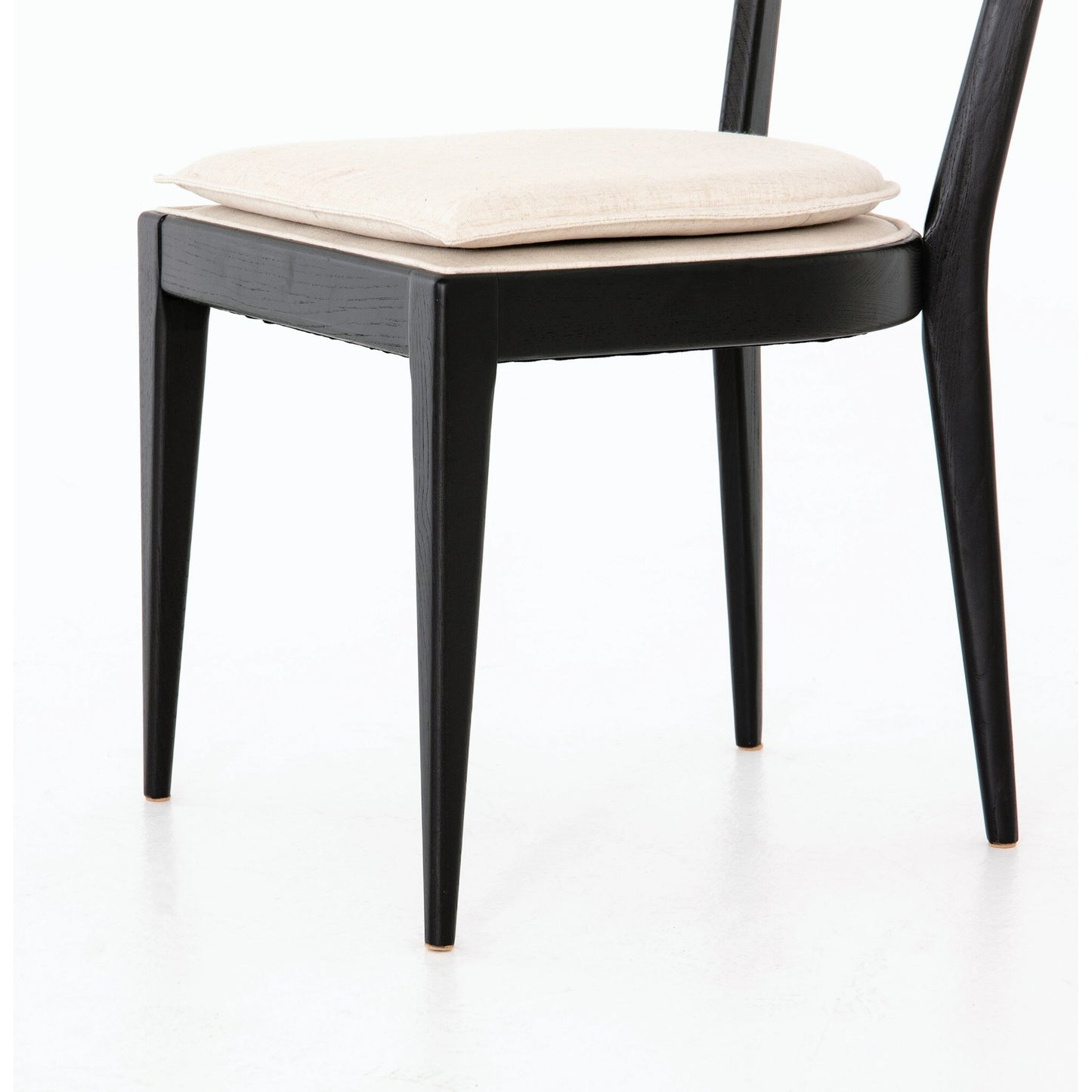 011 SI-2001032 | Closeup | Britt Dining Chair by Four Hands in natural cane, savile flax, brushed ebony. Made from 92% polyester, 8% flax, linen, solid nettlewood, cane in a modern style.