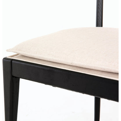 Britt Dining Chair by Four Hands in natural cane, savile flax, brushed ebony. Made from 92% polyester, 8% flax, linen, solid nettlewood, cane in a modern style.