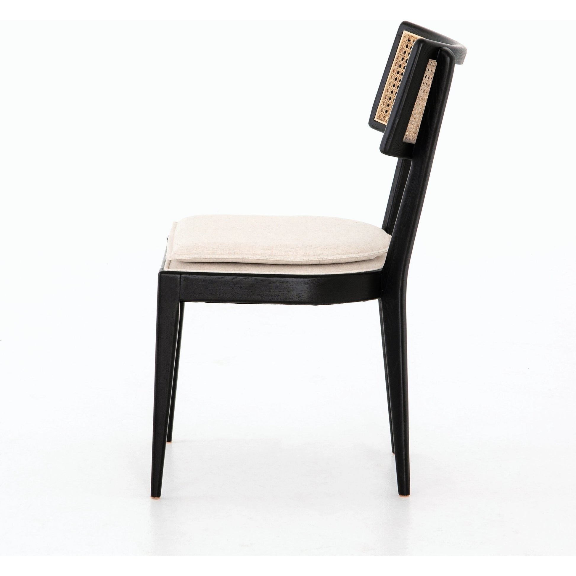 Britt Dining Chair by Four Hands in natural cane, savile flax, brushed ebony. Made from 92% polyester, 8% flax, linen, solid nettlewood, cane in a modern style.