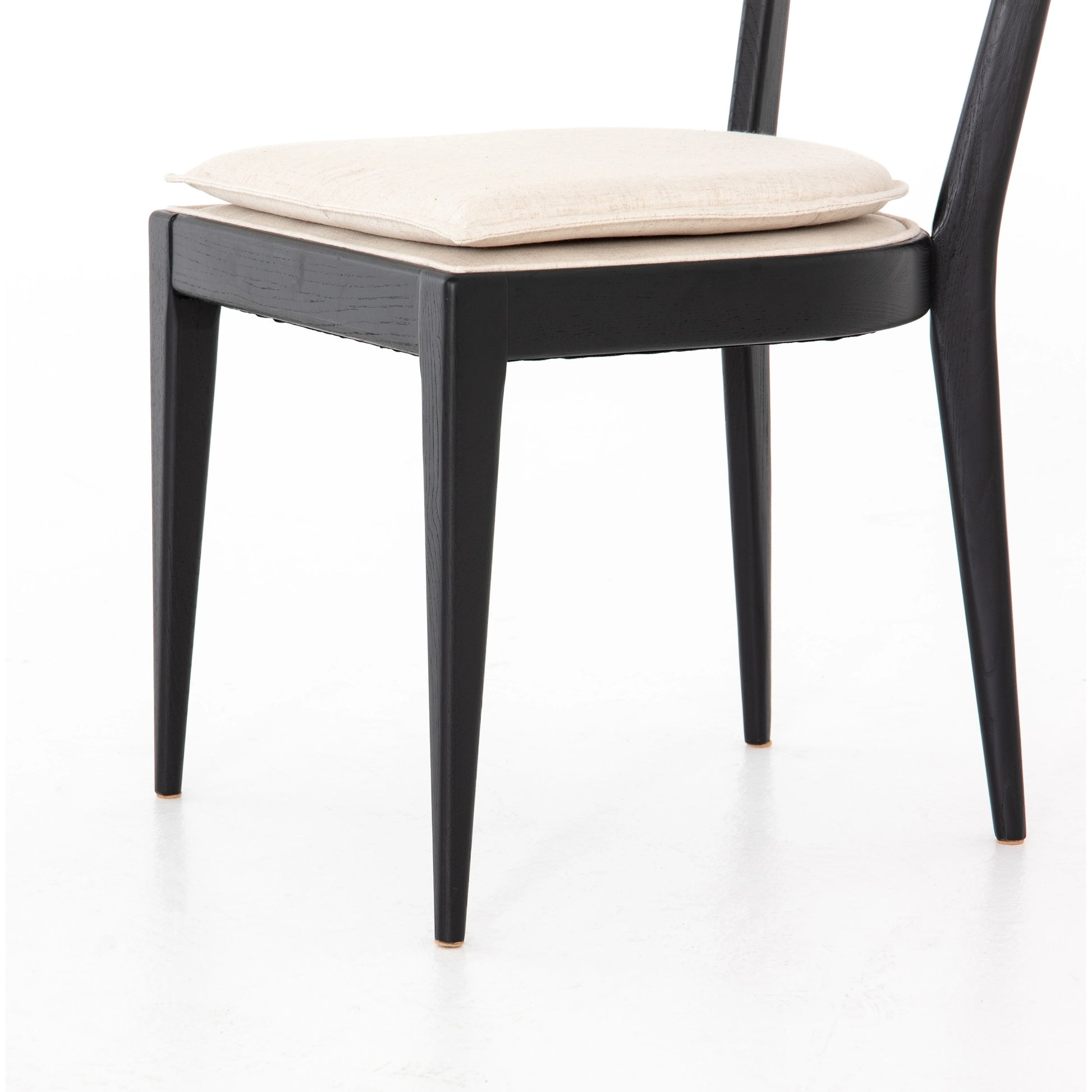 Britt Dining Chair by Four Hands in natural cane, savile flax, brushed ebony. Made from 92% polyester, 8% flax, linen, solid nettlewood, cane in a modern style.