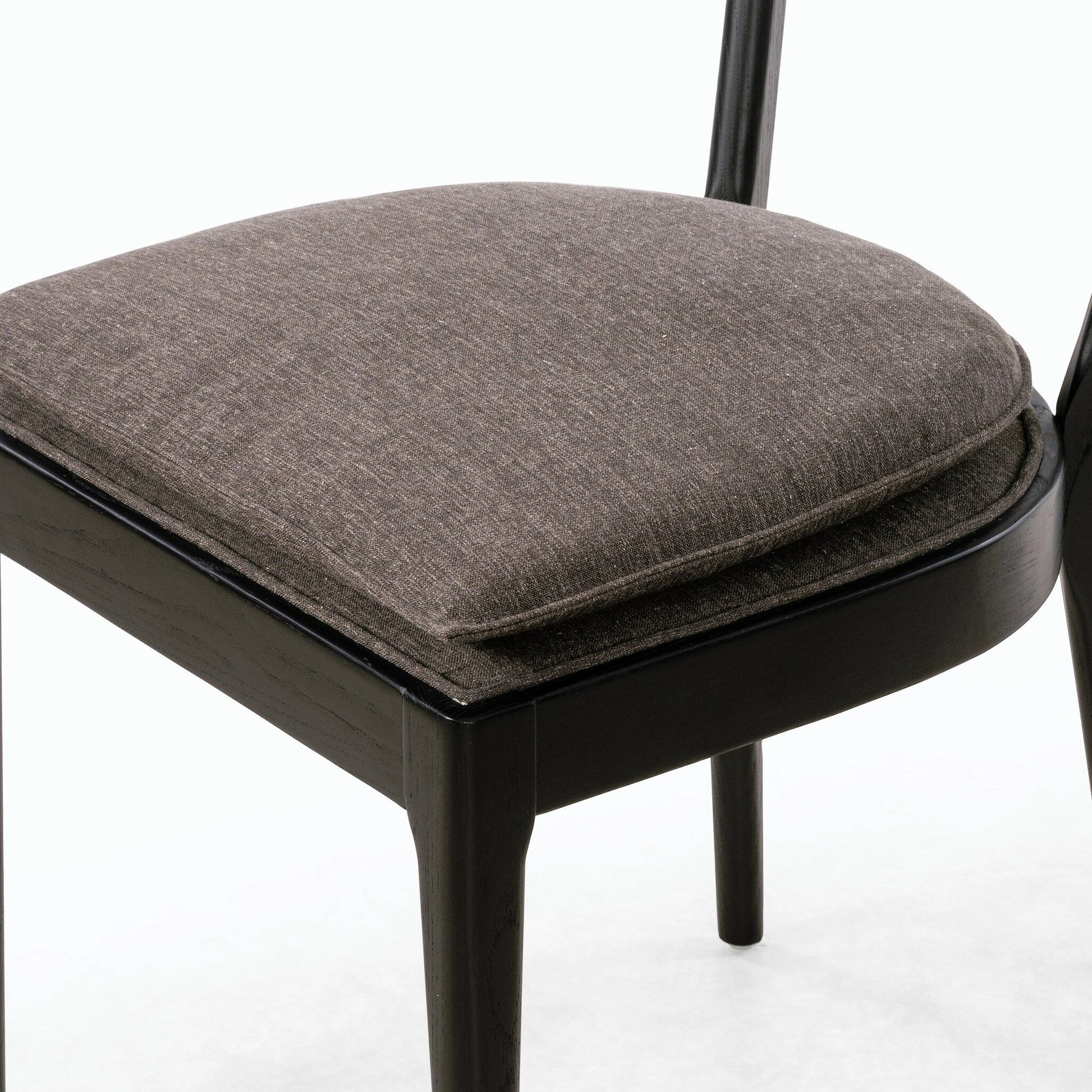 Britt Dining Chair by Four Hands in natural cane, savile flax, brushed ebony. Made from 92% polyester, 8% flax, linen, solid nettlewood, cane in a modern style.