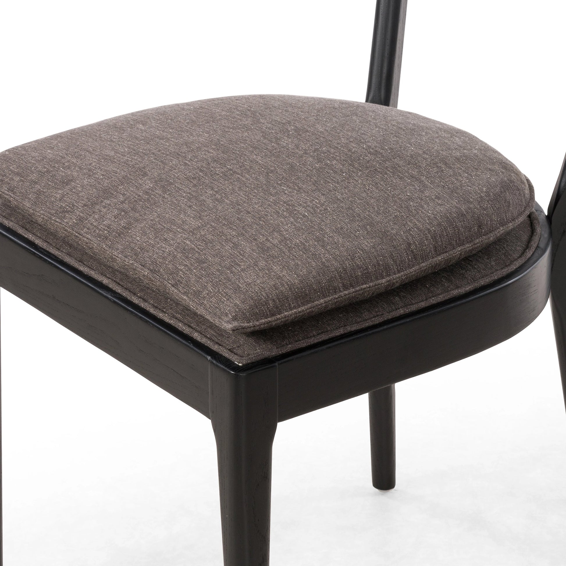 Britt Dining Chair by Four Hands in natural cane, savile flax, brushed ebony. Made from 92% polyester, 8% flax, linen, solid nettlewood, cane in a modern style.