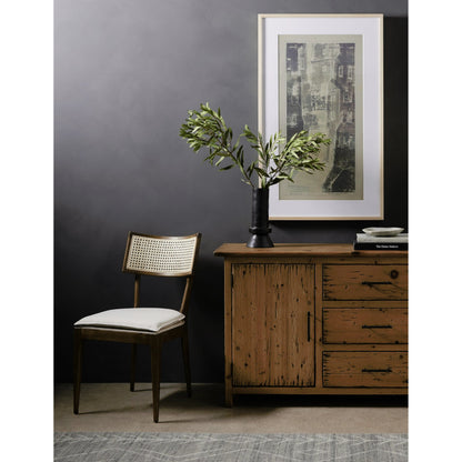 Britt Dining Chair by Four Hands in natural cane, savile flax, brushed ebony. Made from 92% polyester, 8% flax, linen, solid nettlewood, cane in a modern style.