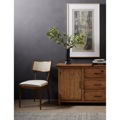 Britt Dining Chair by Four Hands in natural cane, savile flax, brushed ebony. Made from 92% polyester, 8% flax, linen, solid nettlewood, cane in a modern style.