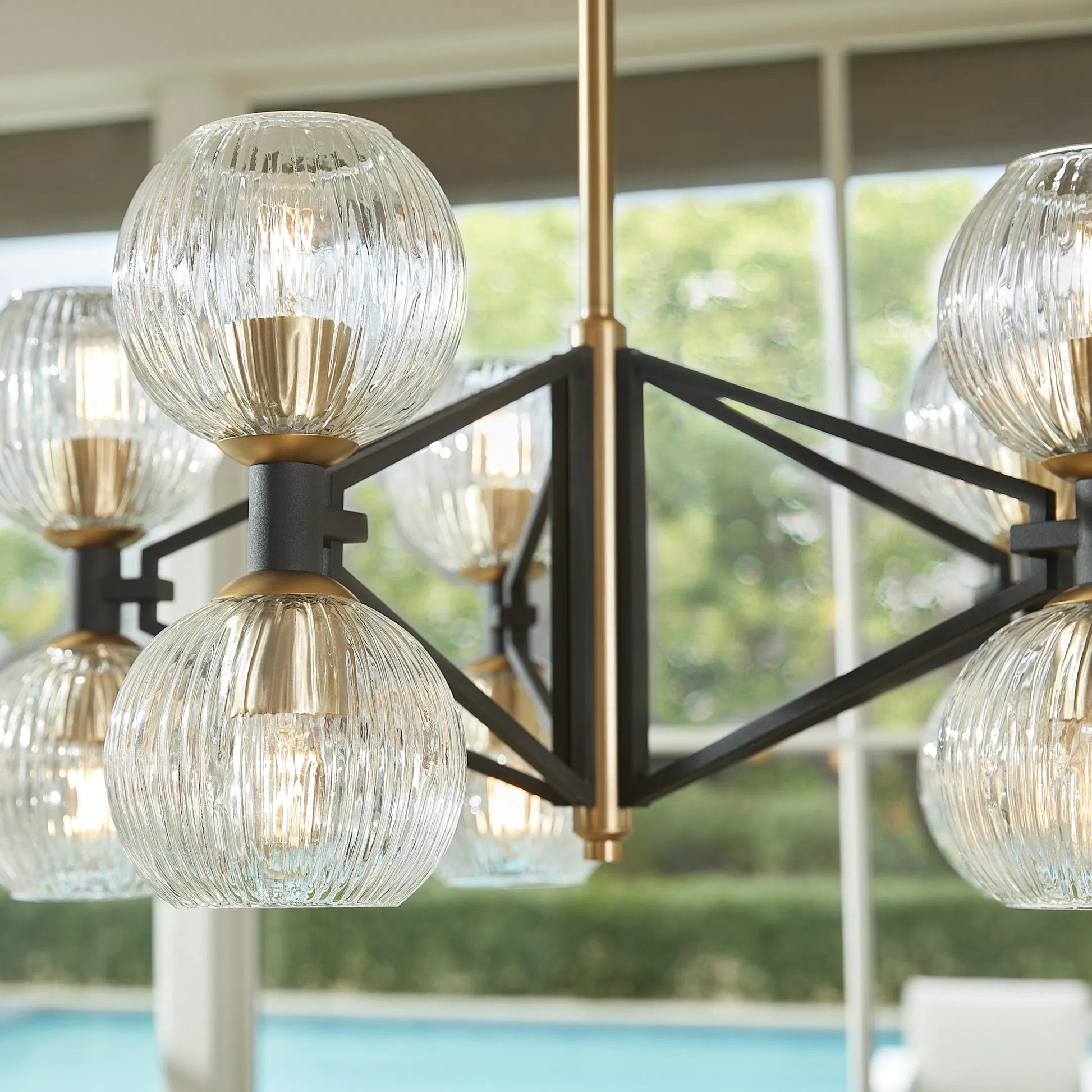 Helios Chandelier by Cyan Design. Made from iron, glass in a transitional style.