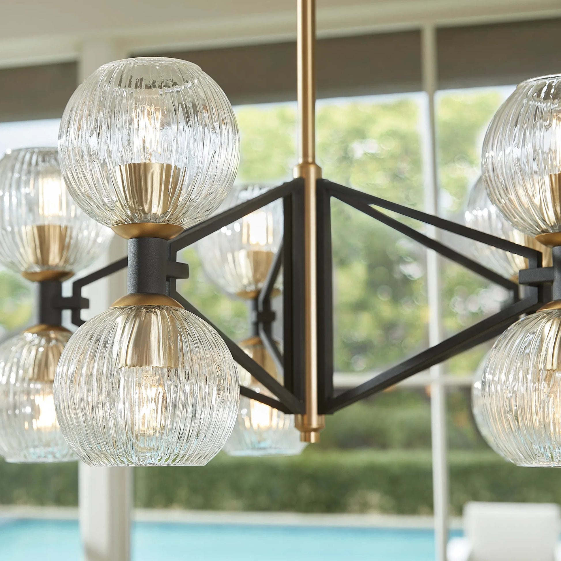Helios Chandelier by Cyan Design. Made from iron, glass in a transitional style.