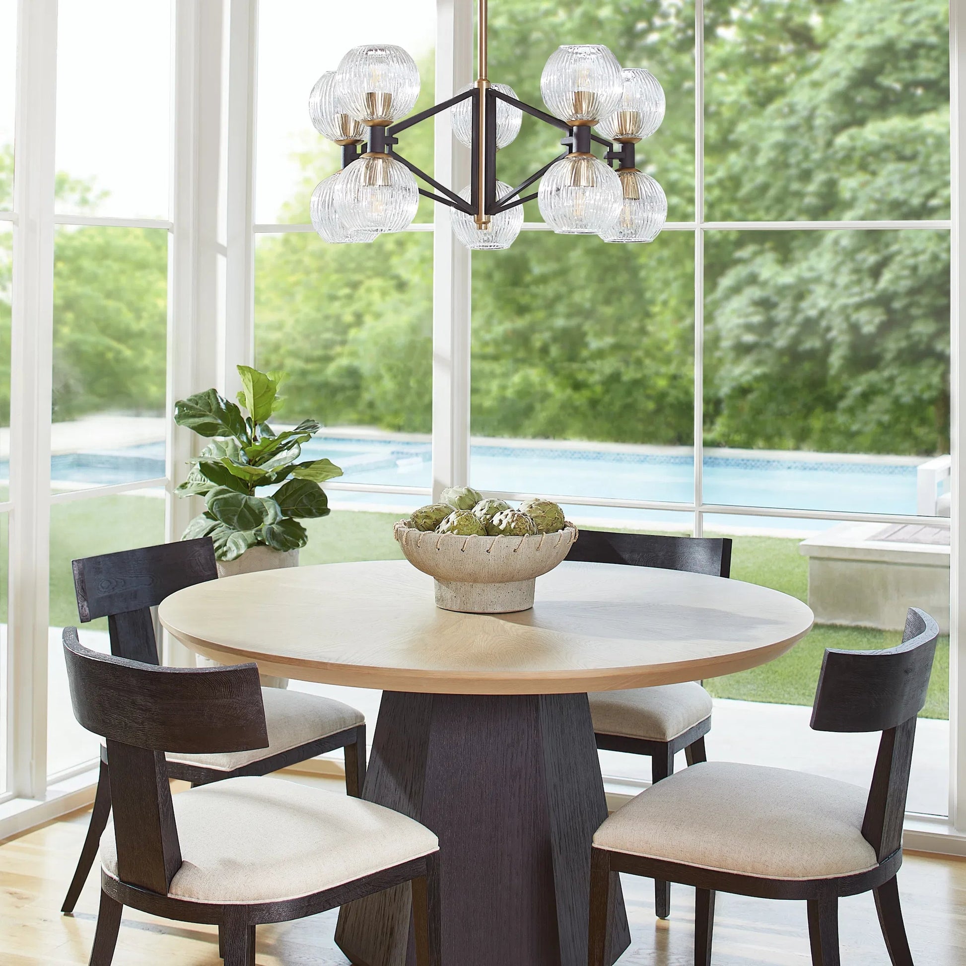Helios Chandelier by Cyan Design. Made from iron, glass in a transitional style.