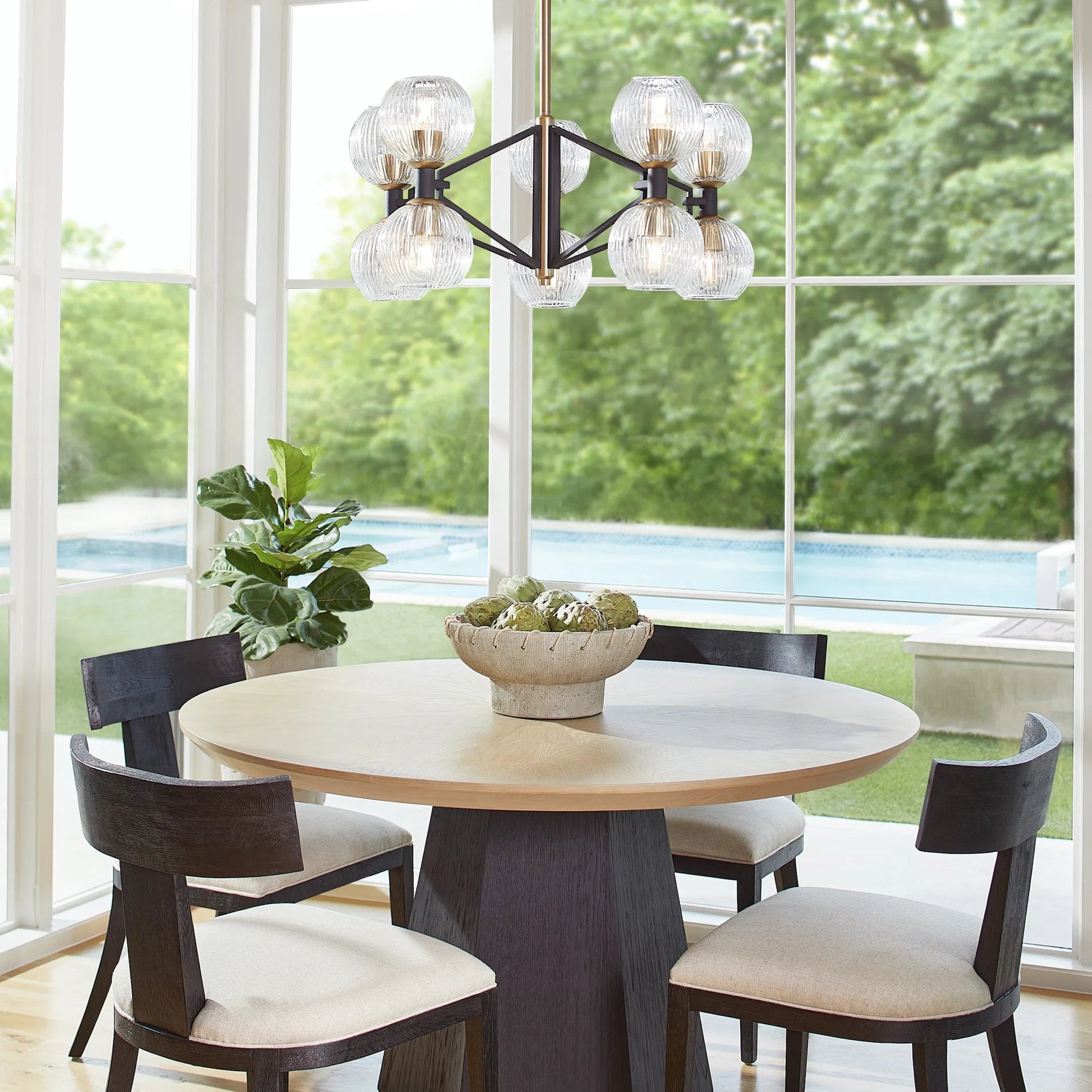 Helios Chandelier by Cyan Design. Made from iron, glass in a transitional style.