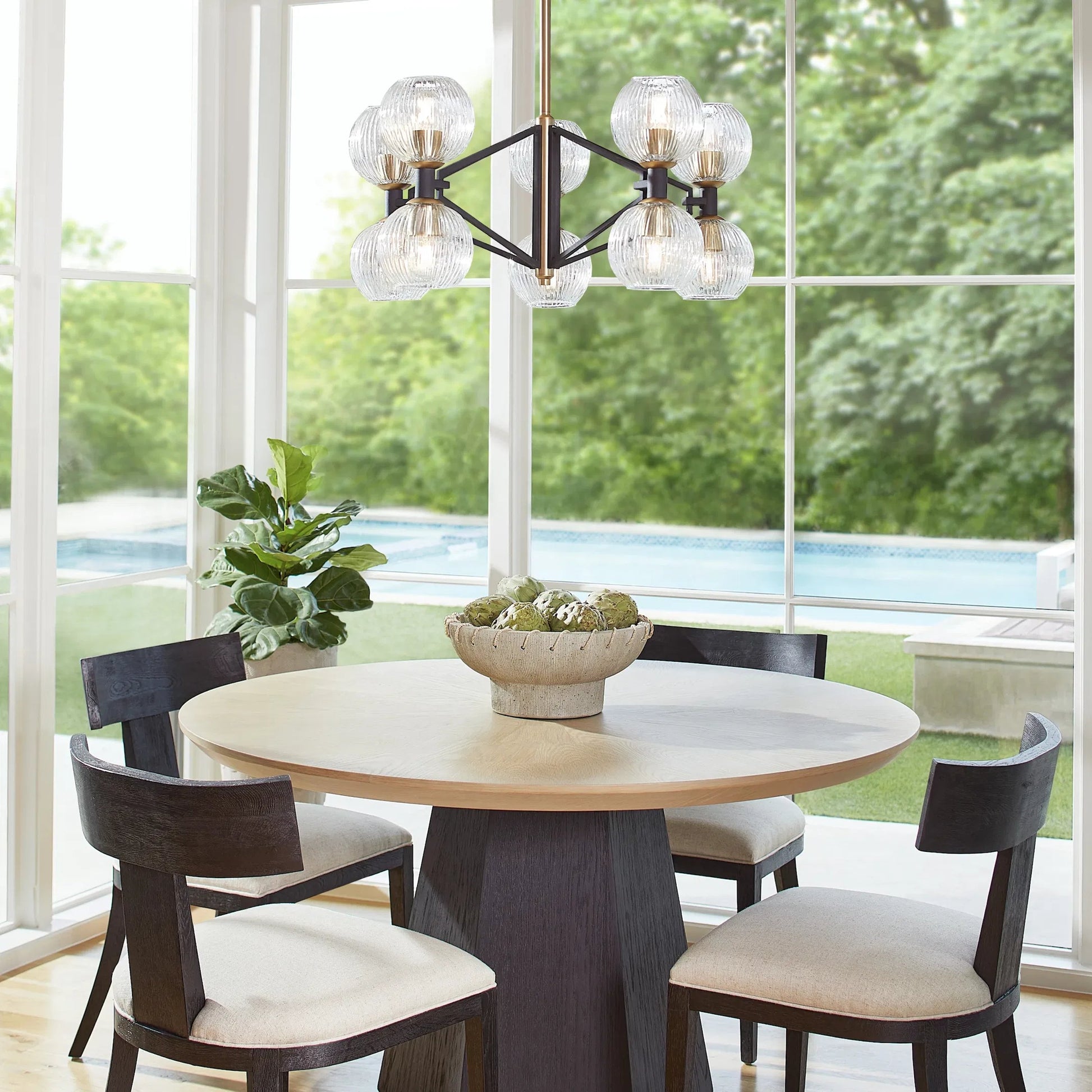 Helios Chandelier by Cyan Design. Made from iron, glass in a transitional style.