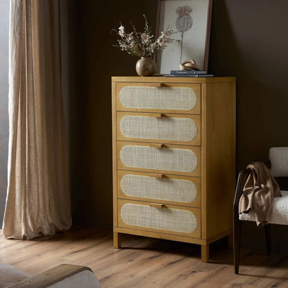 Allegra 5 Drawer Dresser by Four Hands in honey oak veneer, light natural cane, honey oak and honey oak. Made from oak veneer, cane, solid oak in a rustic style.