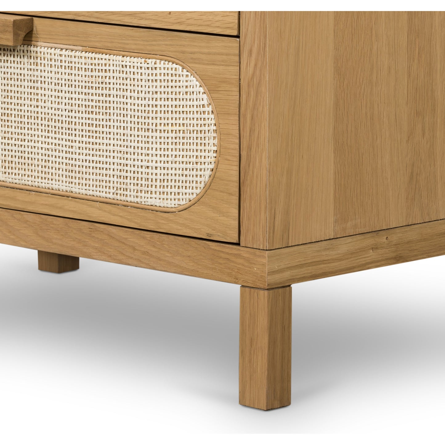 006 SI-1714145 | Closeup | Allegra 5 Drawer Dresser by Four Hands in honey oak veneer, light natural cane, honey oak and honey oak. Made from oak veneer, cane, solid oak in a rustic style.
