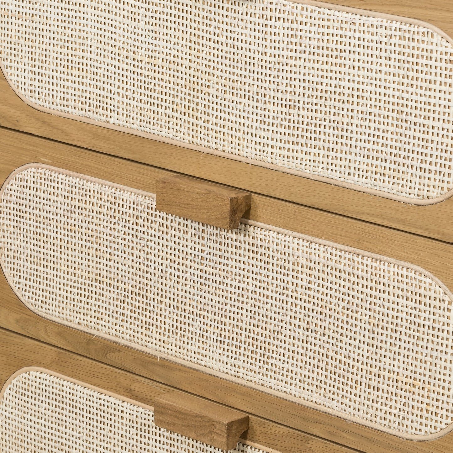 007 SI-1714145 | Closeup | Allegra 5 Drawer Dresser by Four Hands in honey oak veneer, light natural cane, honey oak and honey oak. Made from oak veneer, cane, solid oak in a rustic style.