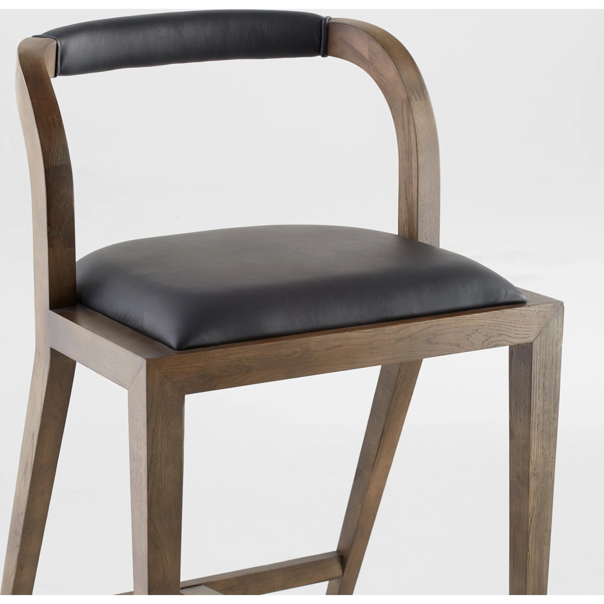 Caralia Bar Stool by Cyan Design in black. Made from wood in a modern style.