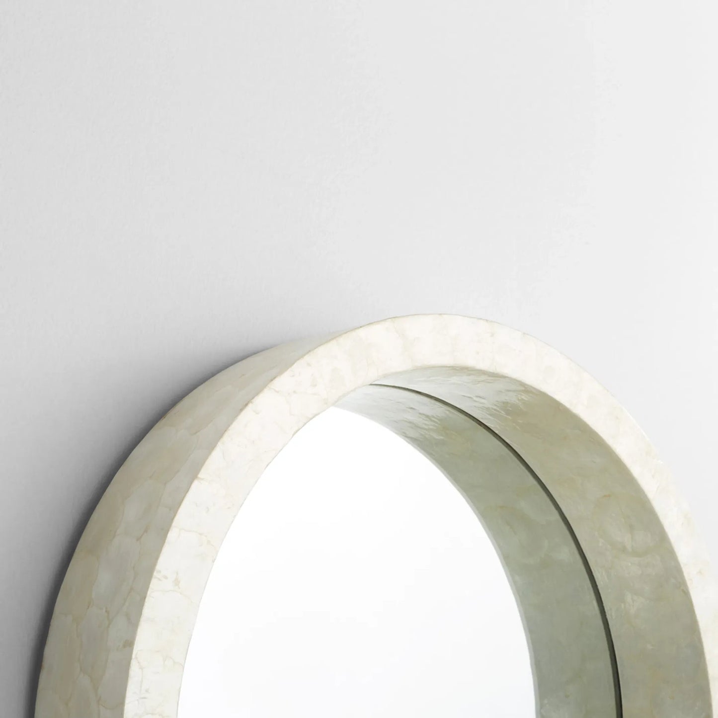 005 SI-1987431 | Closeup | Triton Round Mirror by Cyan Design. Made from capiz, wood, mirrored glass in a modern style.