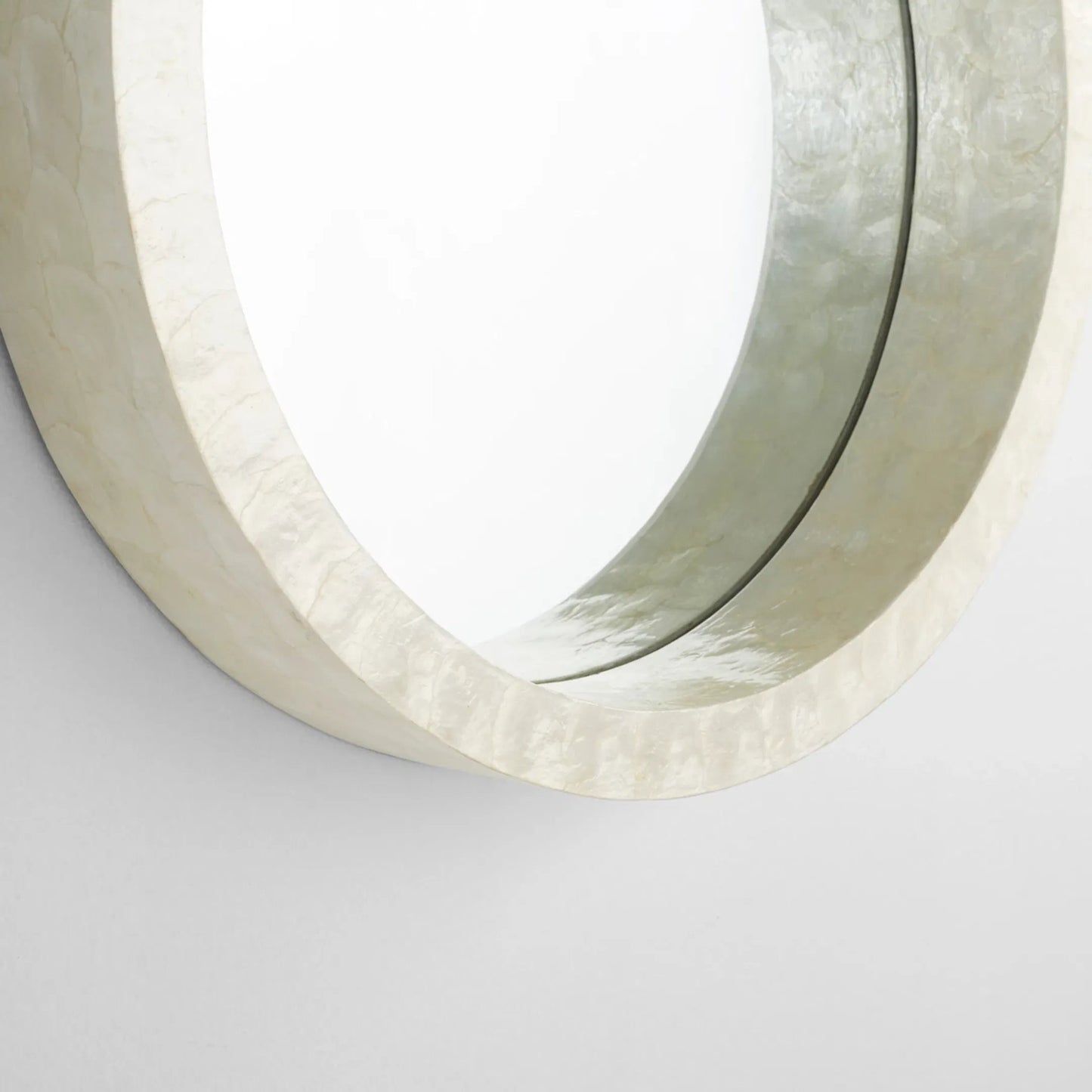 006 SI-1987431 | Closeup | Triton Round Mirror by Cyan Design. Made from capiz, wood, mirrored glass in a modern style.