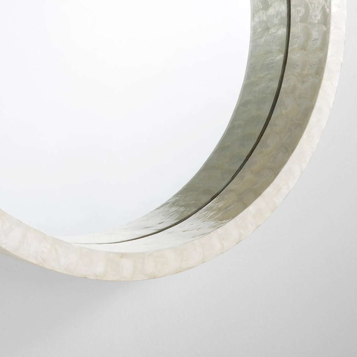 007 SI-1987432 | Closeup | Triton Round Mirror by Cyan Design. Made from capiz, wood, mirrored glass in a modern style.