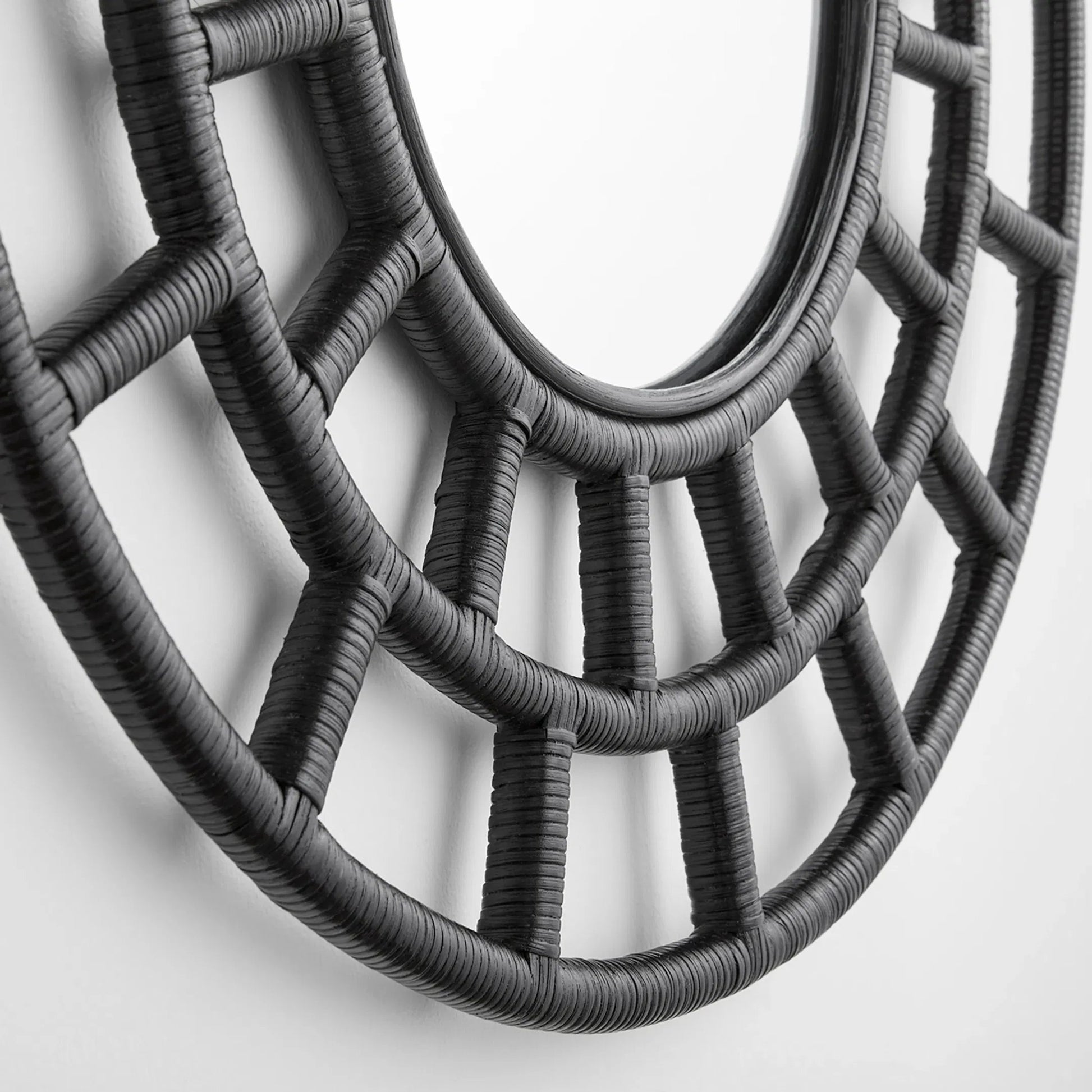 Comoros Mirror by Cyan Design. Made from rattan, wood, mirrored glass in a modern style.