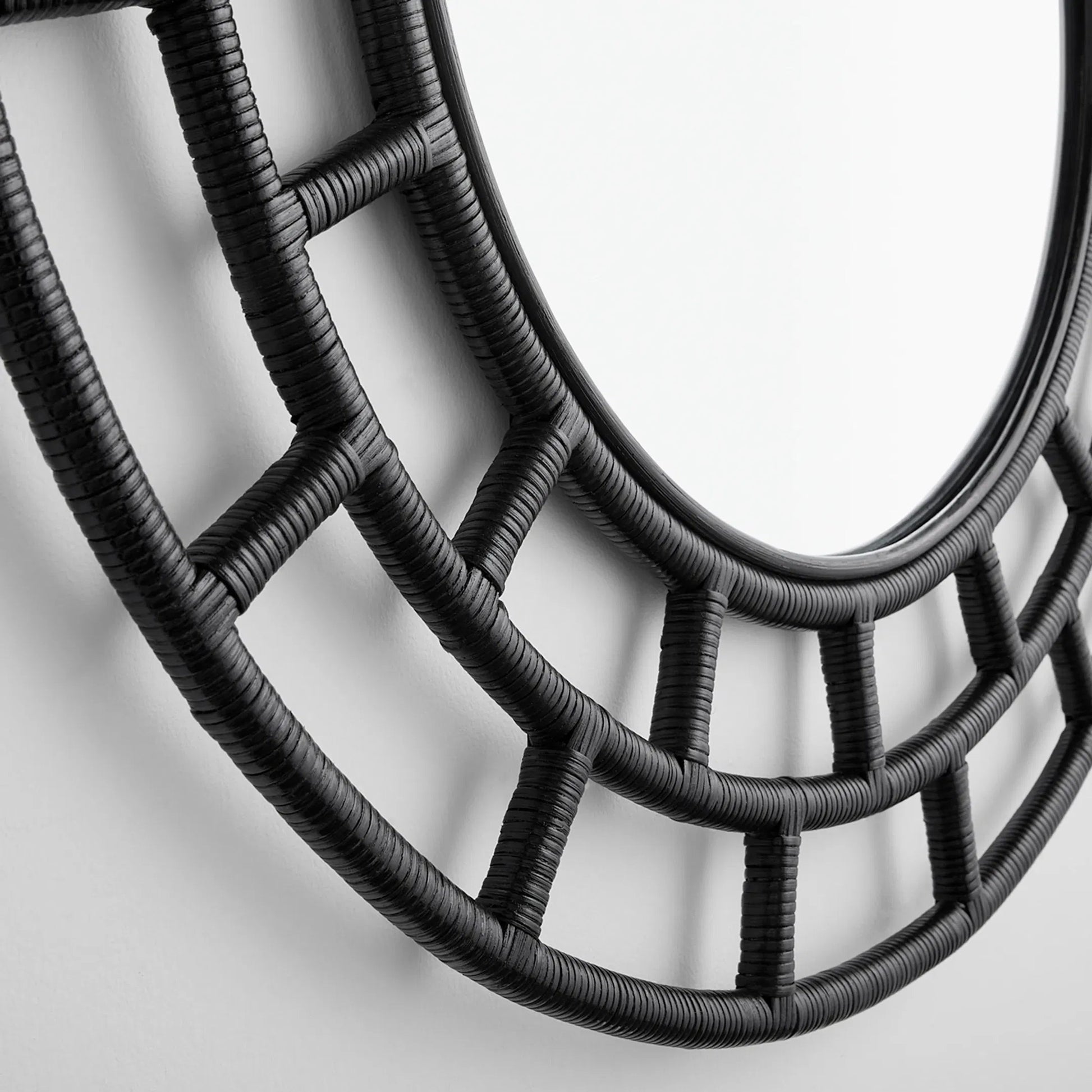 Comoros Mirror by Cyan Design. Made from rattan, wood, mirrored glass in a modern style.