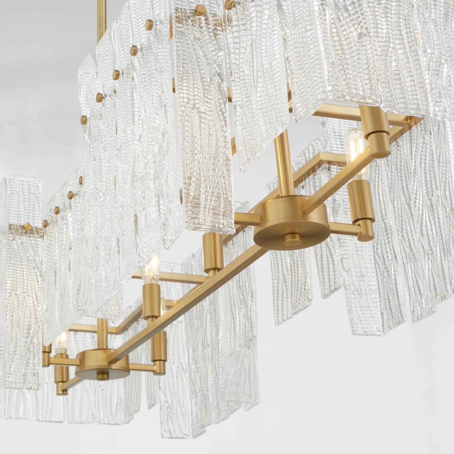 011 SI-2130427 | Closeup | Othello 8 Light Linear by Cyan Design in aged brass. Made from unique in a modern style.