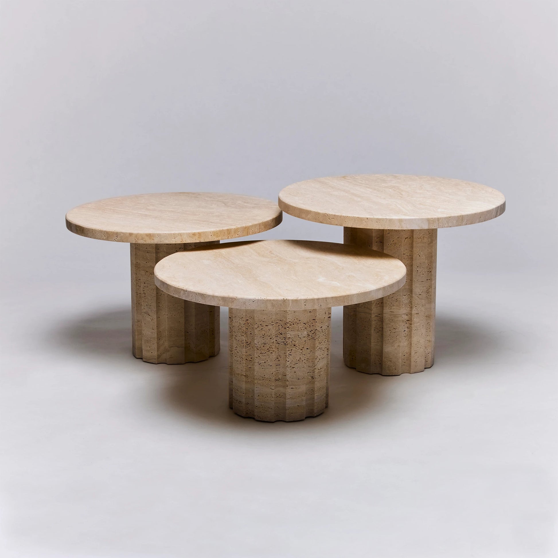 Amerigo Bunching Tables by Interlude Home in raw travertine. Made from travertine in a modern style.