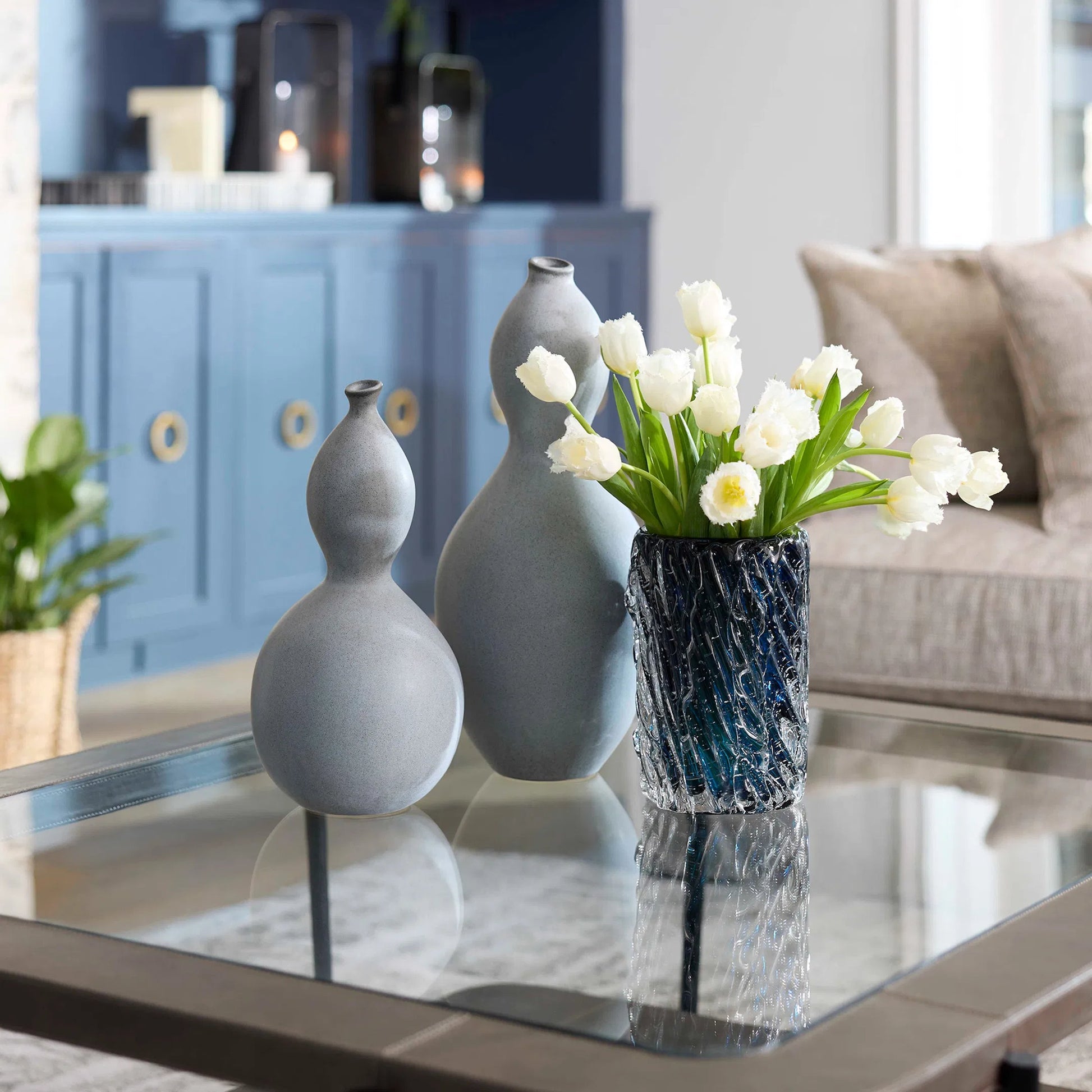 Thorough Vase by Cyan Design in blue. Made from art glass in a coastal style.