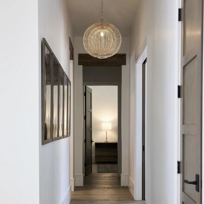 Terrae Round Pendant by Cyan Design in aged brass. Made from rattan, metal in a rustic style.