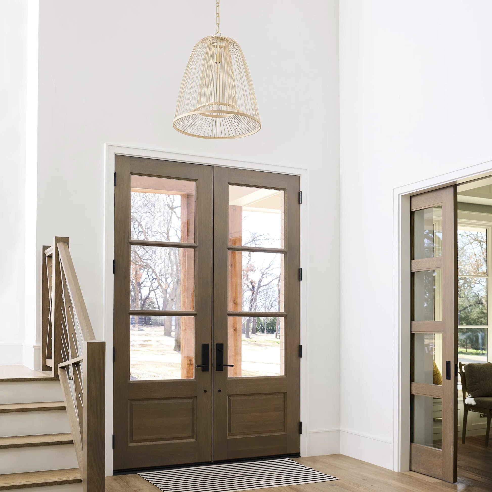 Terrae Bell Pendant by Cyan Design in aged brass. Made from rattan, metal in a rustic style.