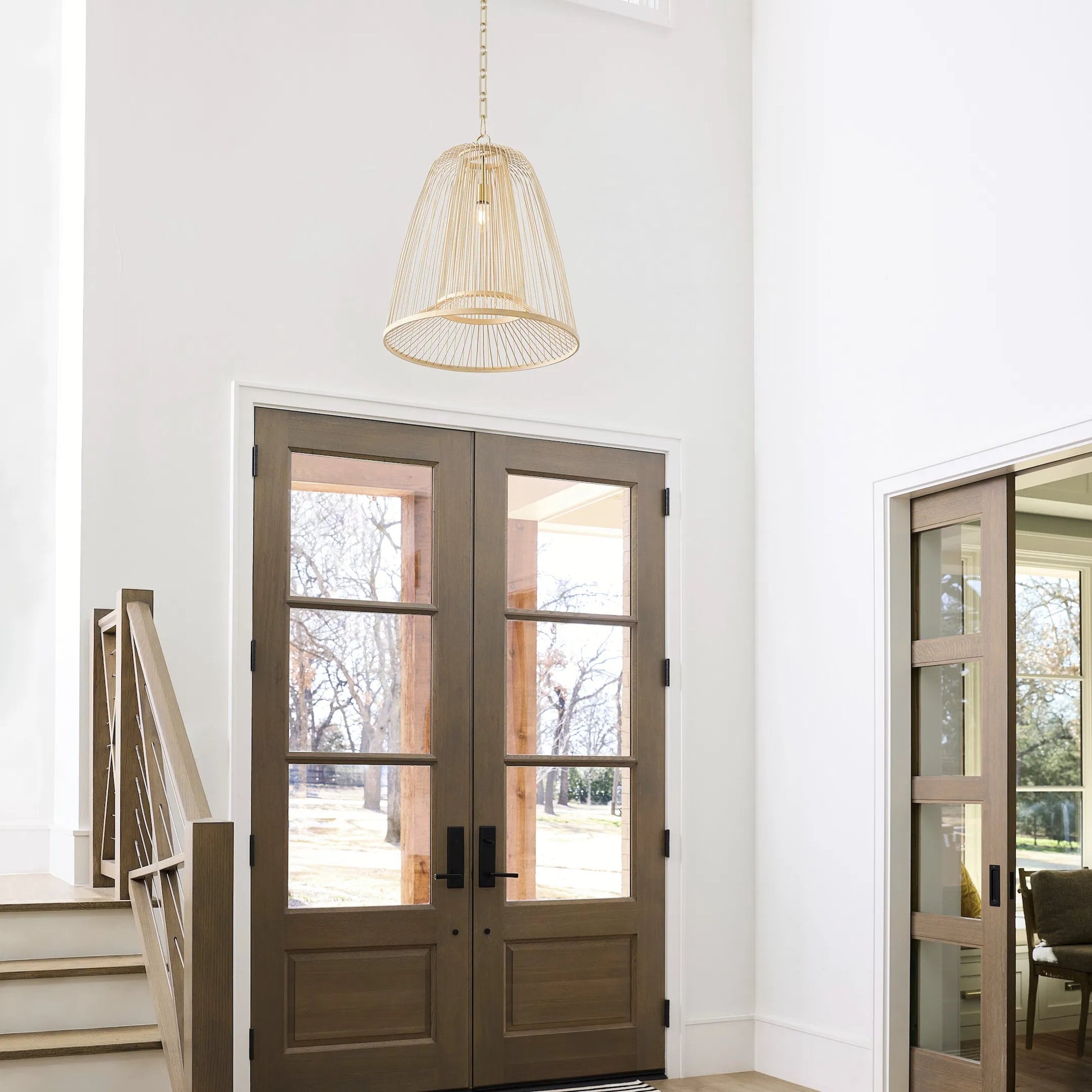 Terrae Bell Pendant by Cyan Design in aged brass. Made from rattan, metal in a rustic style.