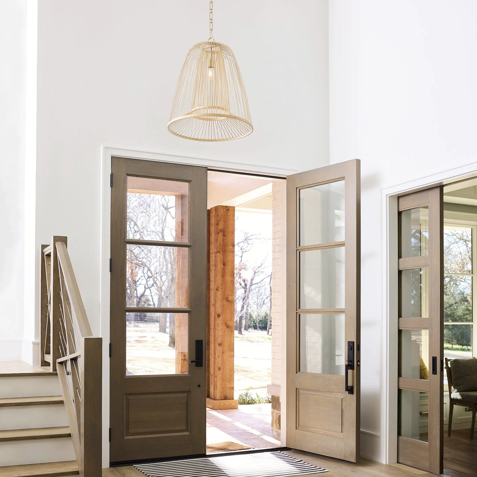 Terrae Bell Pendant by Cyan Design in aged brass. Made from rattan, metal in a rustic style.