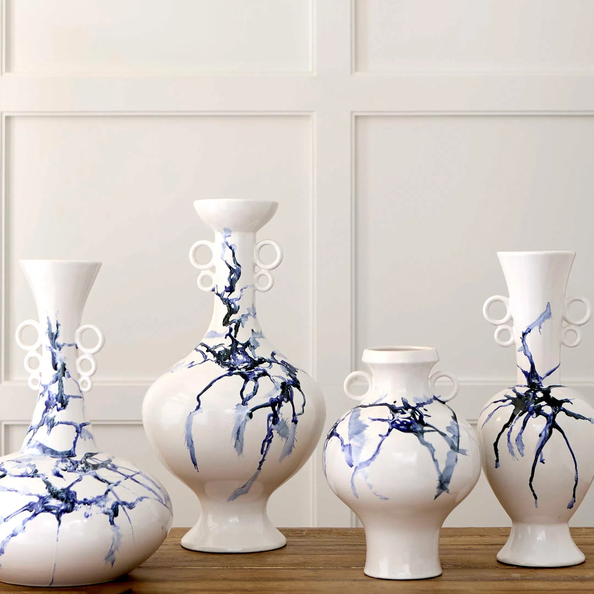 Nola Vase by Cyan Design in white, cobalt blue, black. Made from ceramic in a transitional style.