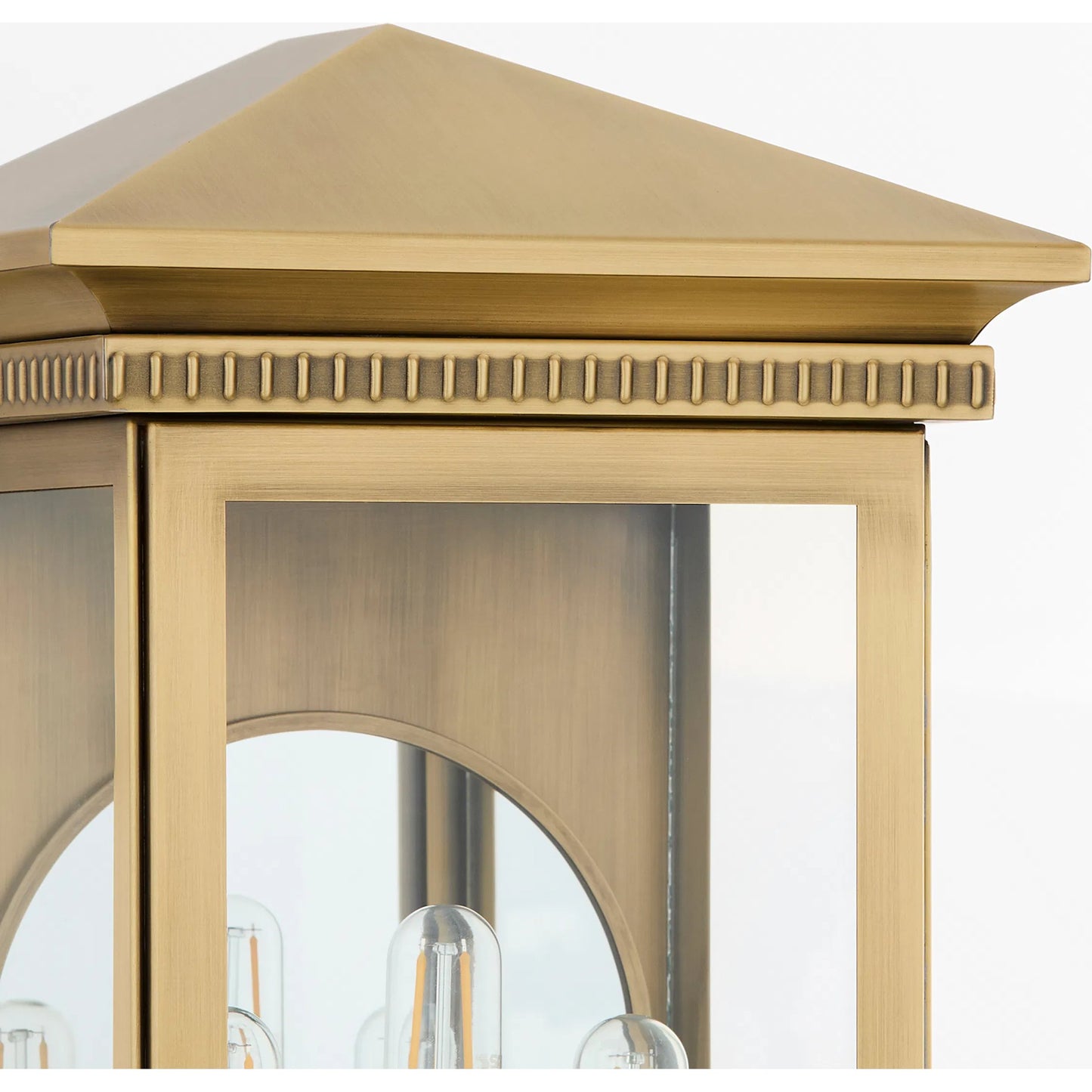 002 SI-2328621 | Closeup | Guilford 3 Light Outdoor Wall Sconce by Cyan Design in heritage brass. Made from brass, glass in a cottage & farmhouse style.