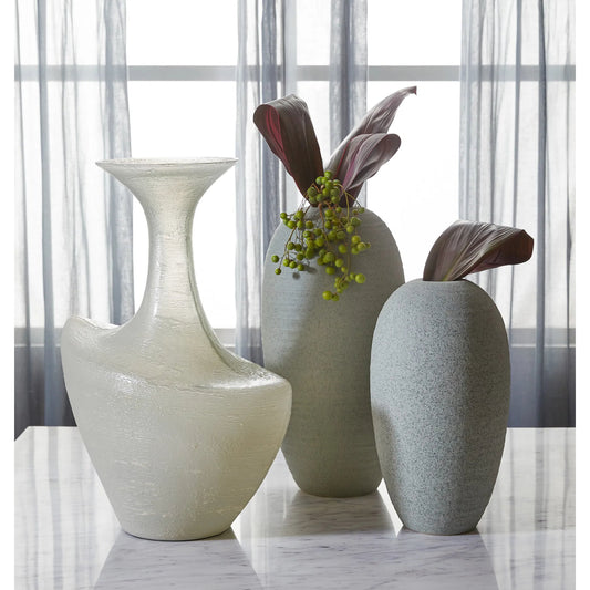 Taku Bottle Vase by Cyan Design in icy teal. Made from glass in a unique style.