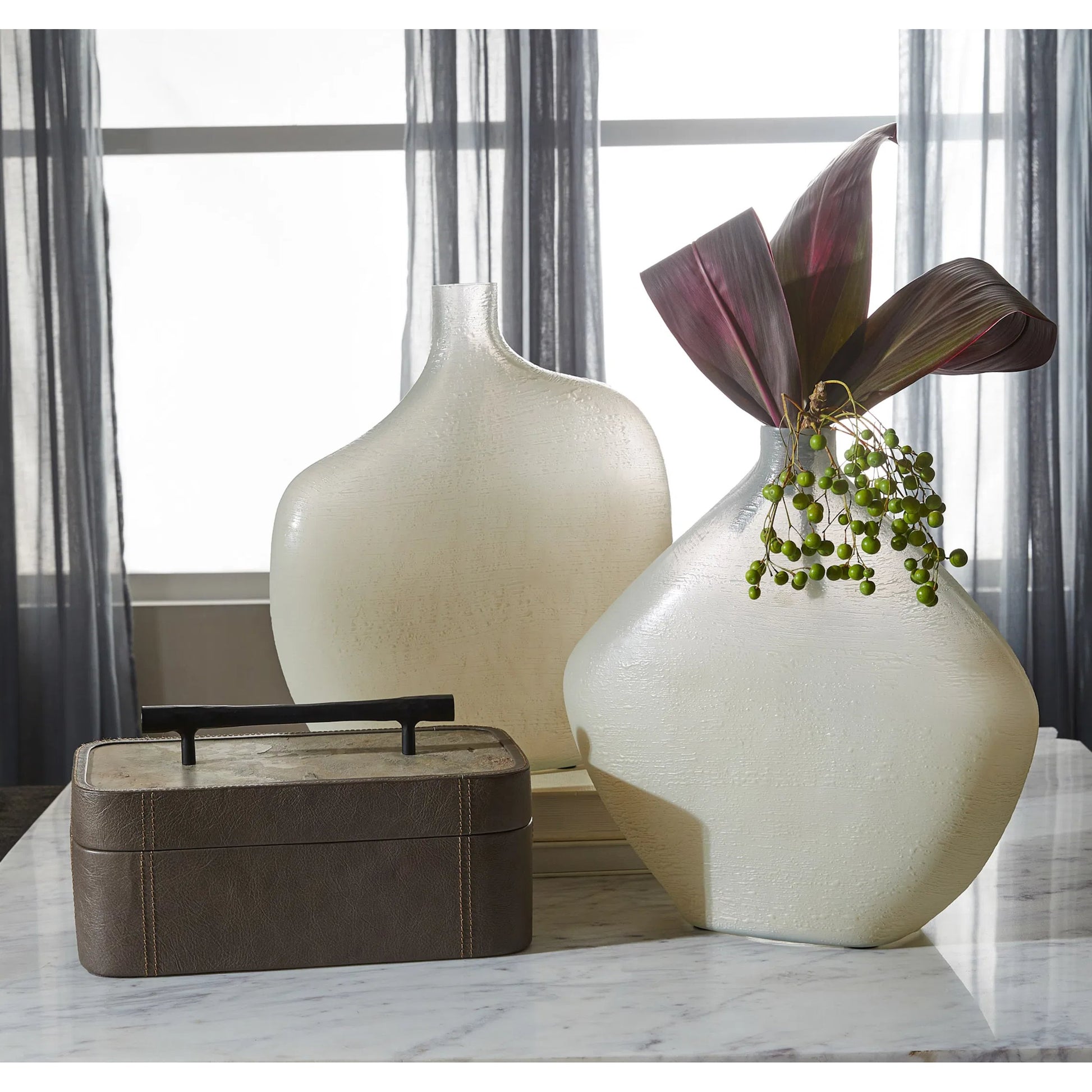 Taku Round Vase by Cyan Design in icy teal. Made from glass in a transitional style.