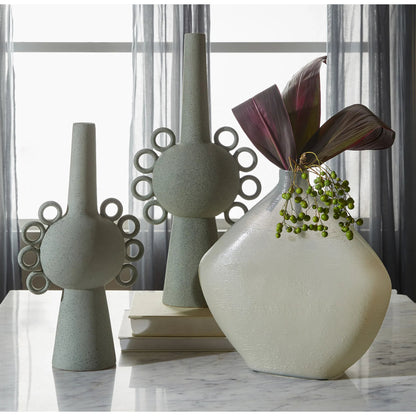 Taku Round Vase by Cyan Design in icy teal. Made from glass in a transitional style.