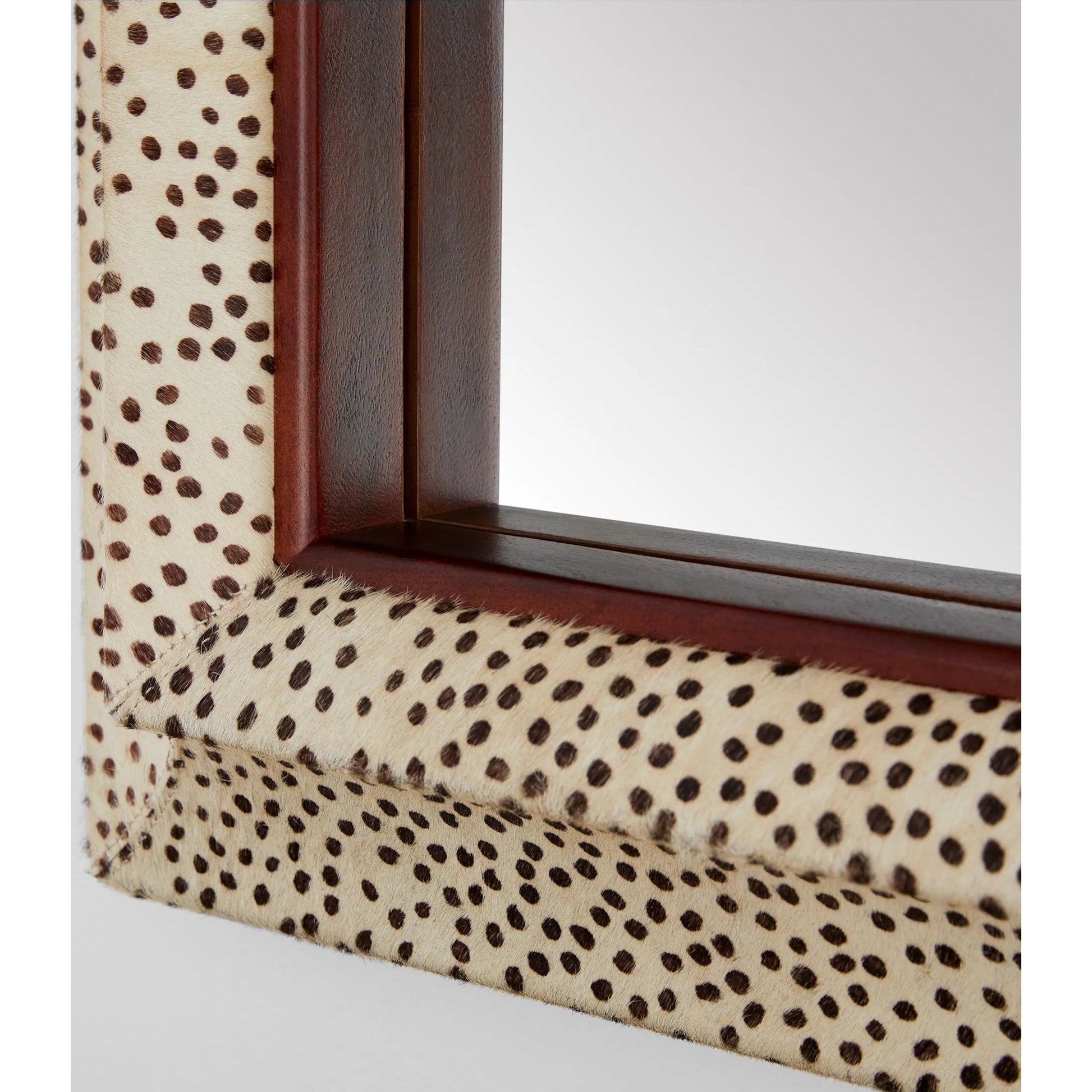 Gaborone Mirror by Cyan Design in walnut. Made from hide leather, mirrored glass in a eclectic & global style.
