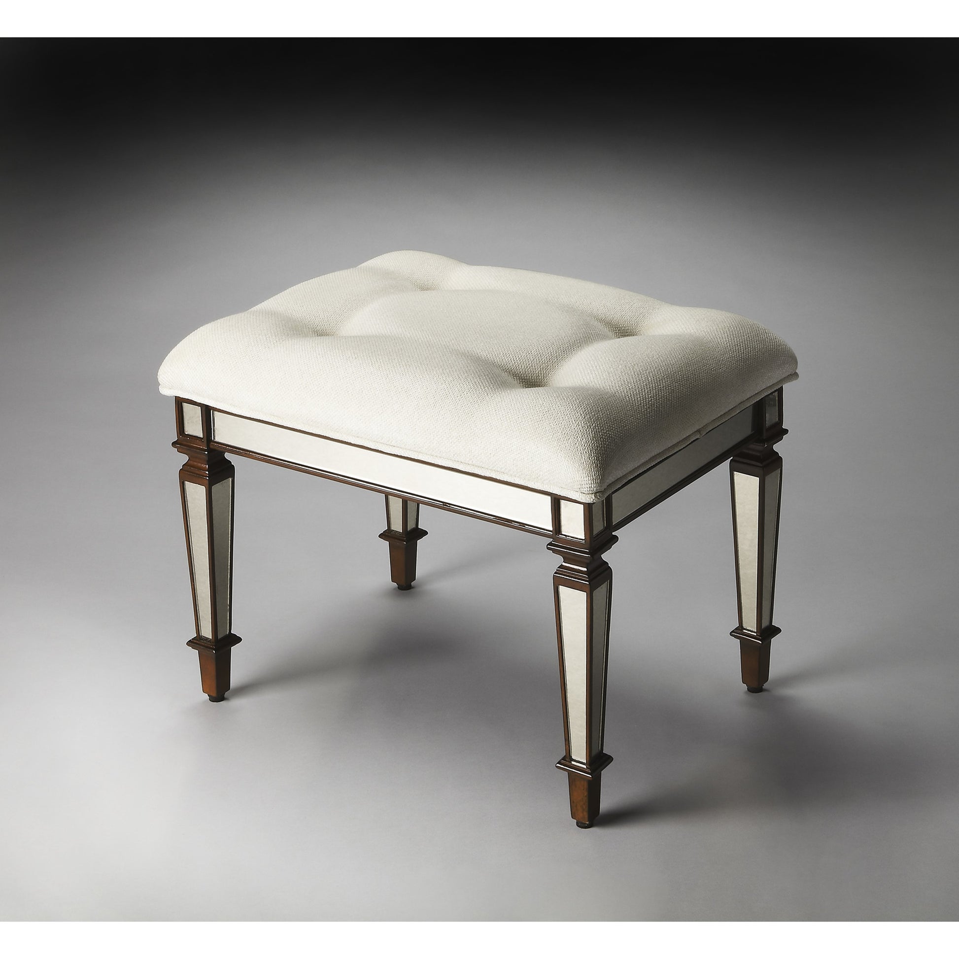 Celeste Mirrored Vanity Seat by Butler Specialty Company in silver and mirror. Made from poplar solids, mdf, antique mirrored glass, cotton, urethane foam in a traditional style.