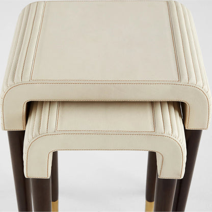 Channel Nesting Tables (Set of 2) by Cyan Design in off white, walnut. Made from leather, mdf, brass in a transitional style.