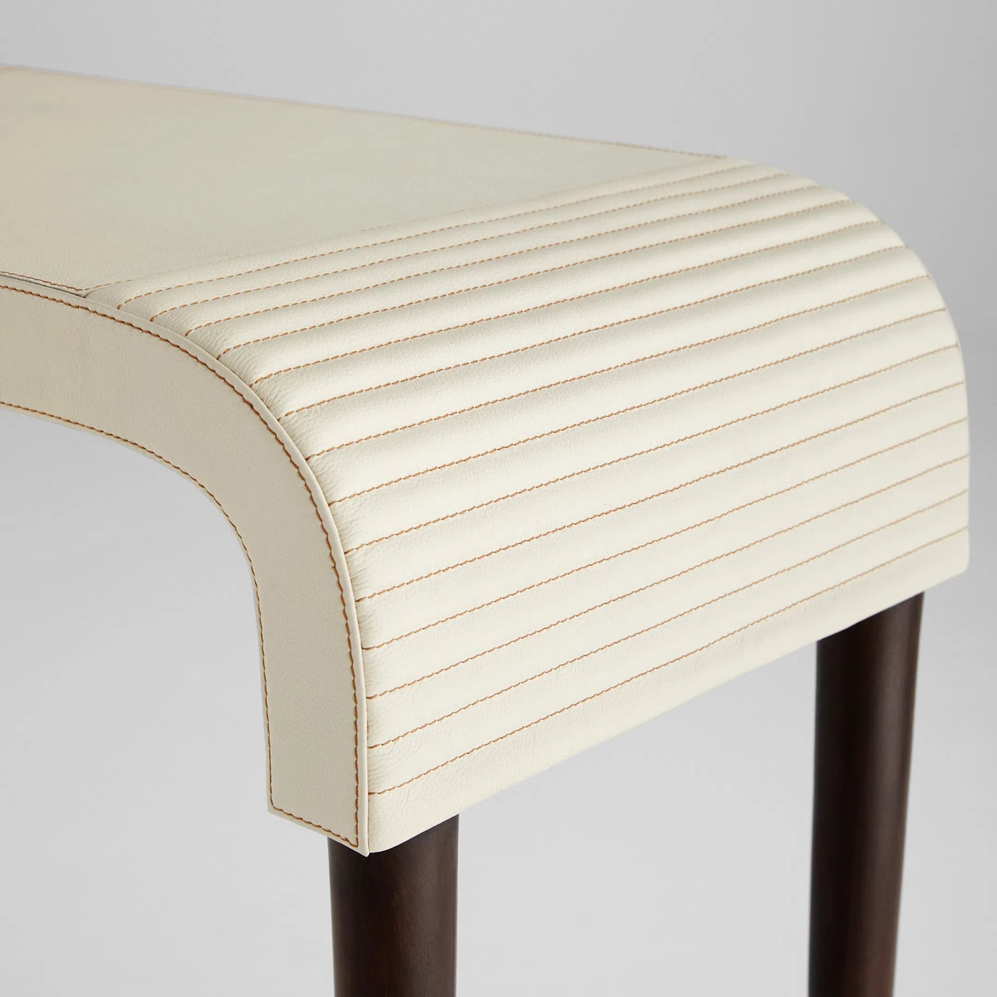 002 SI-2328574 | Closeup | Channel Console Table by Cyan Design in off white, walnut. Made from leather, mdf, brass in a transitional style.