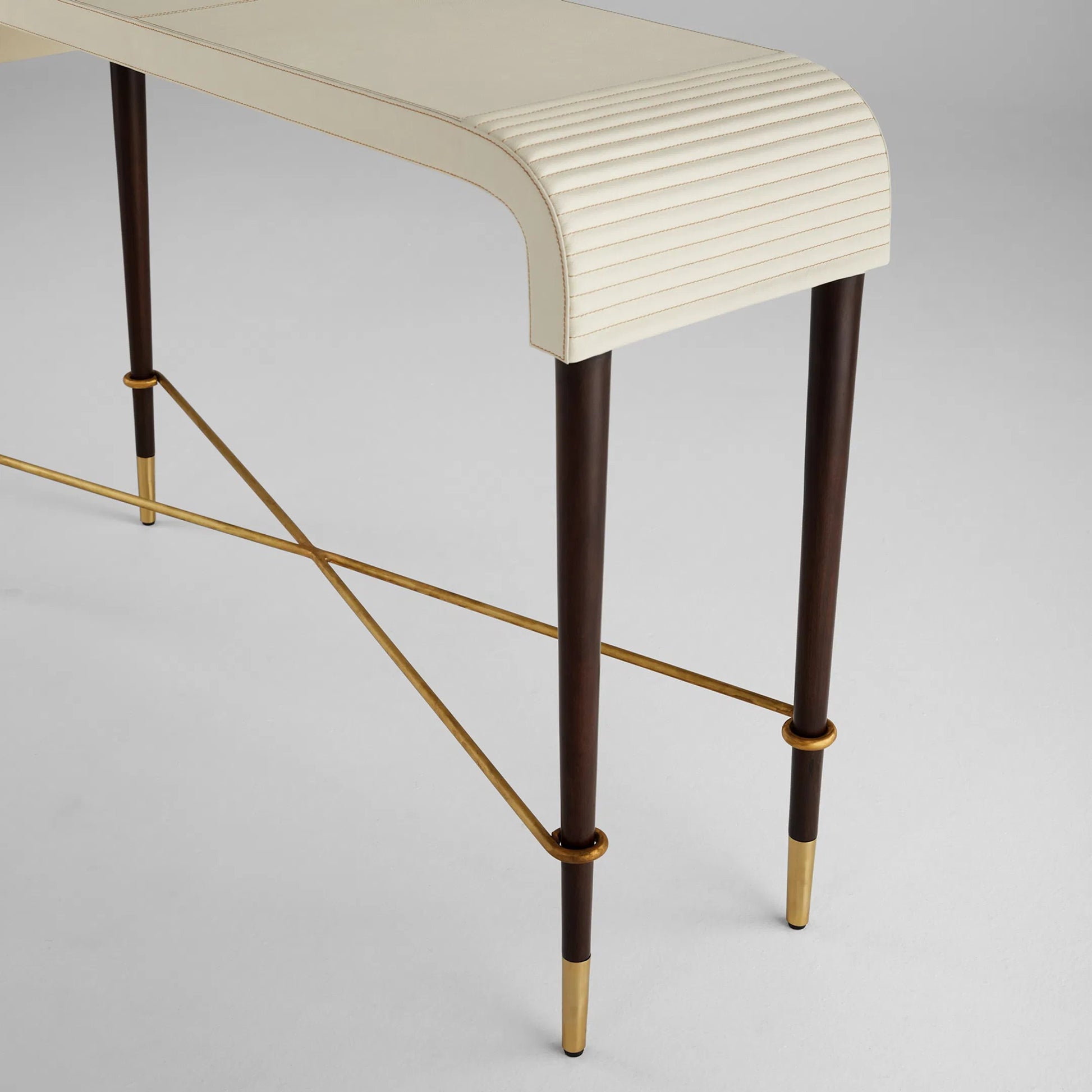 Channel Console Table by Cyan Design in off white, walnut. Made from leather, mdf, brass in a transitional style.