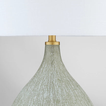 Ambella Table Lamp by Cyan Design in textured matte white, antique brass, white. Made from glass, mild steel, linen in a transitional style.