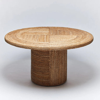 Laguna Dining Table by Interlude Home in brown and light satin. Made from banana bark in a rustic style.