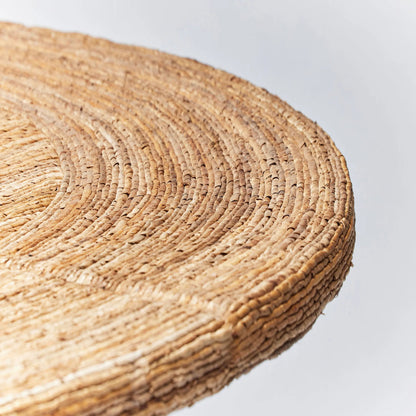 Laguna Dining Table by Interlude Home in brown and light satin. Made from banana bark in a rustic style.