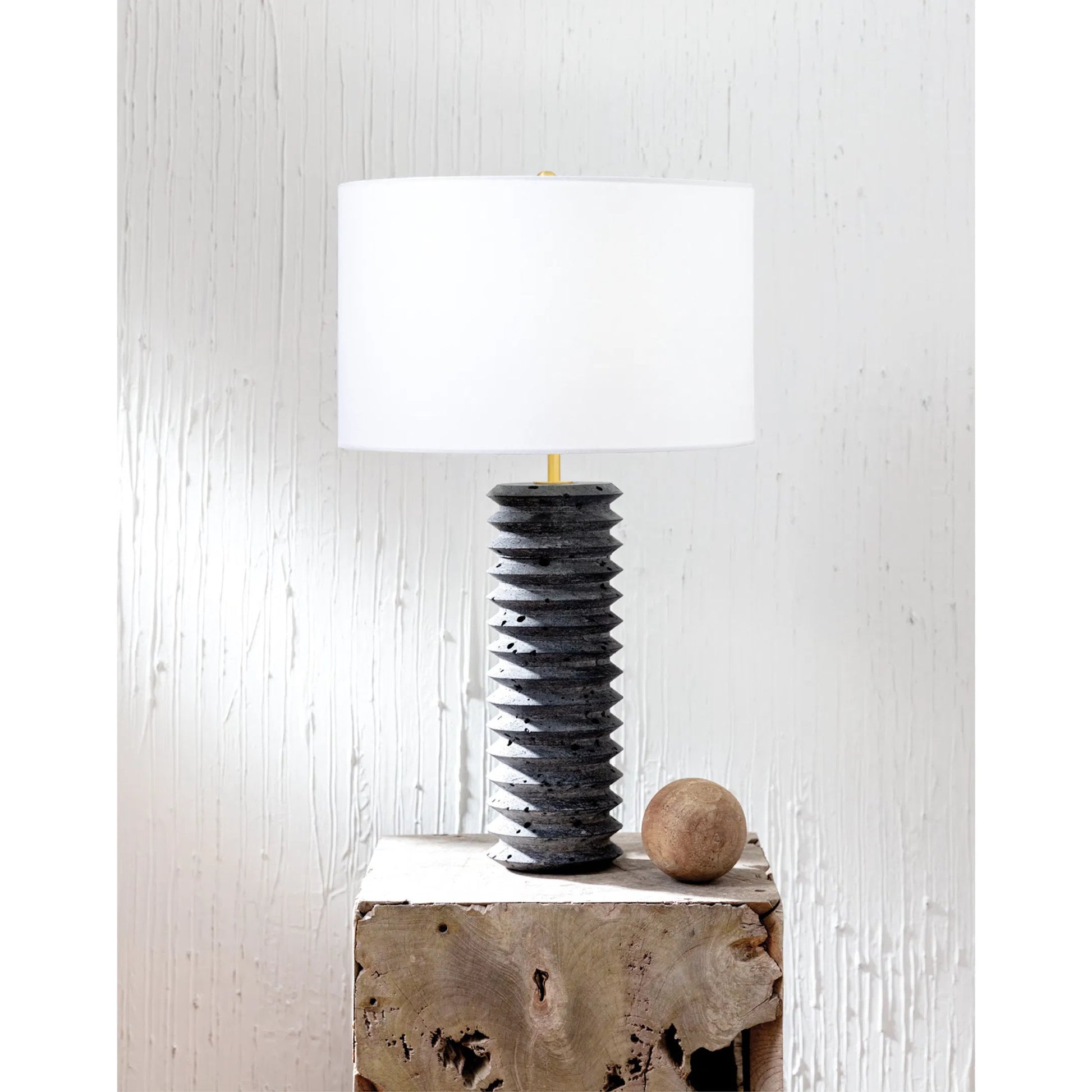 Noir Column Travertine Lamp by Regina Andrew in black and natural stone. Made from stone in a modern style.