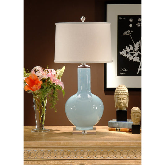 Cayden Lamp by Wildwood in pale blue glaze, wood, clear. Made from ceramic, porcelain in a transitional style.