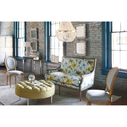 Oyster Shell Mirror by Currey and Company in natural shell. Made from wood, oyster shell, mirror in a coastal style.