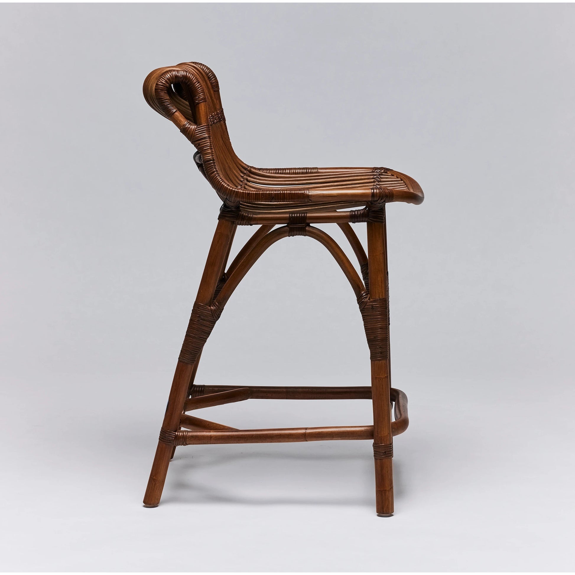 Naples Counter Stool by Interlude Home in warm taupe. Made from rattan in a cottage & farmhouse style.