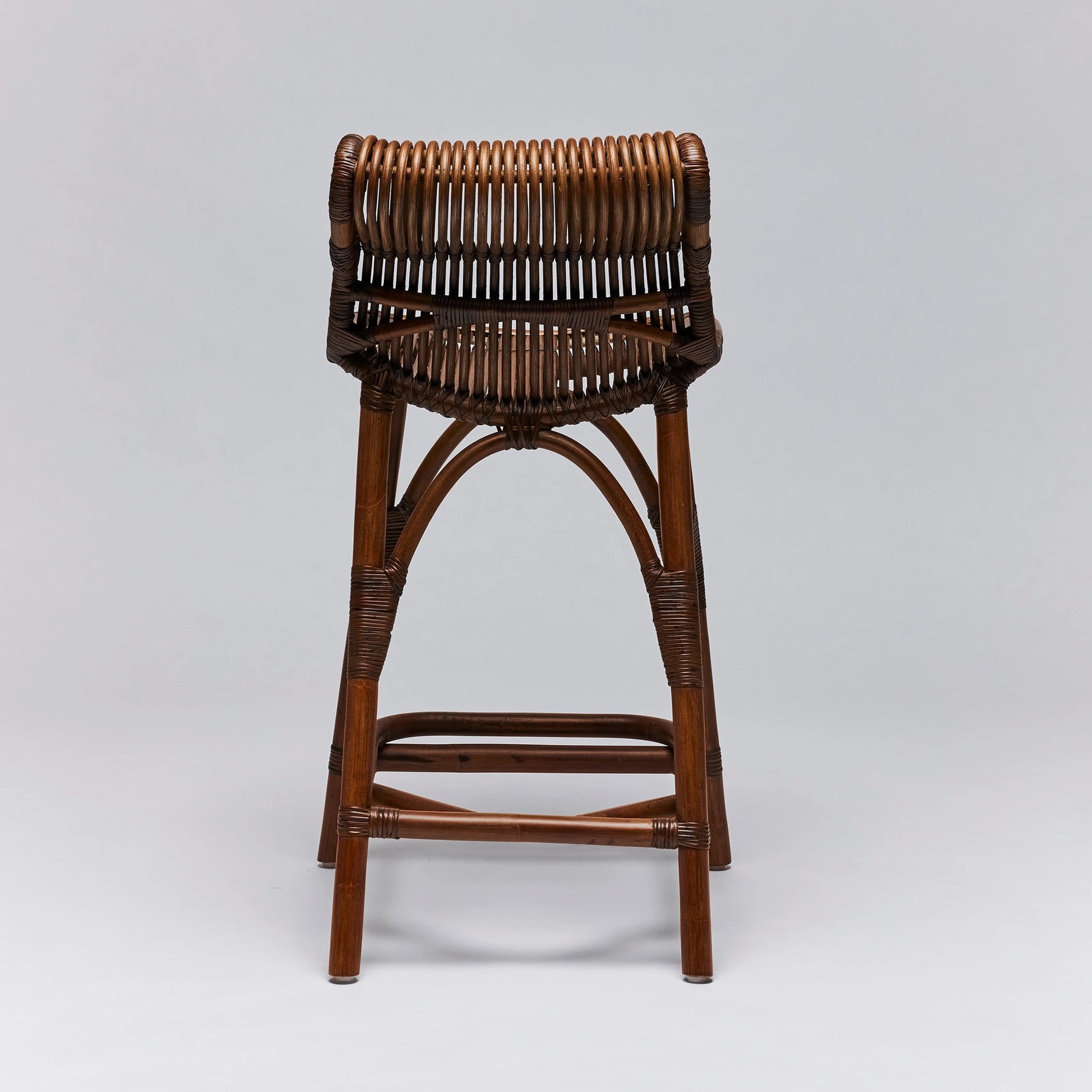 Naples Counter Stool by Interlude Home in warm taupe. Made from rattan in a cottage & farmhouse style.